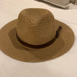 Tan hat with brown strap detail